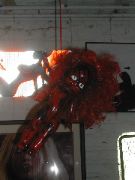 Creapy Red Baby hanging over the gift shop corner