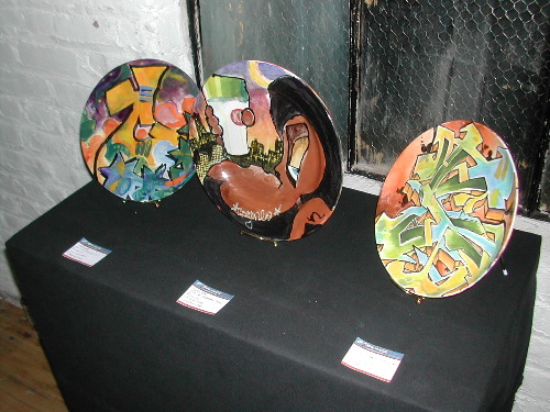 Three painted plates