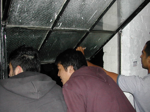 A bunch of guys jump out the window. Mind you we're on the fifth floor of this complex.