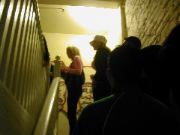 Top of the stairs, we wait in line to get in.