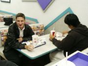 Paul and Ji enjoy the Whoppers, even though they will put pounds on you.